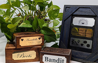 different metal engraved plaques on boxes or framed